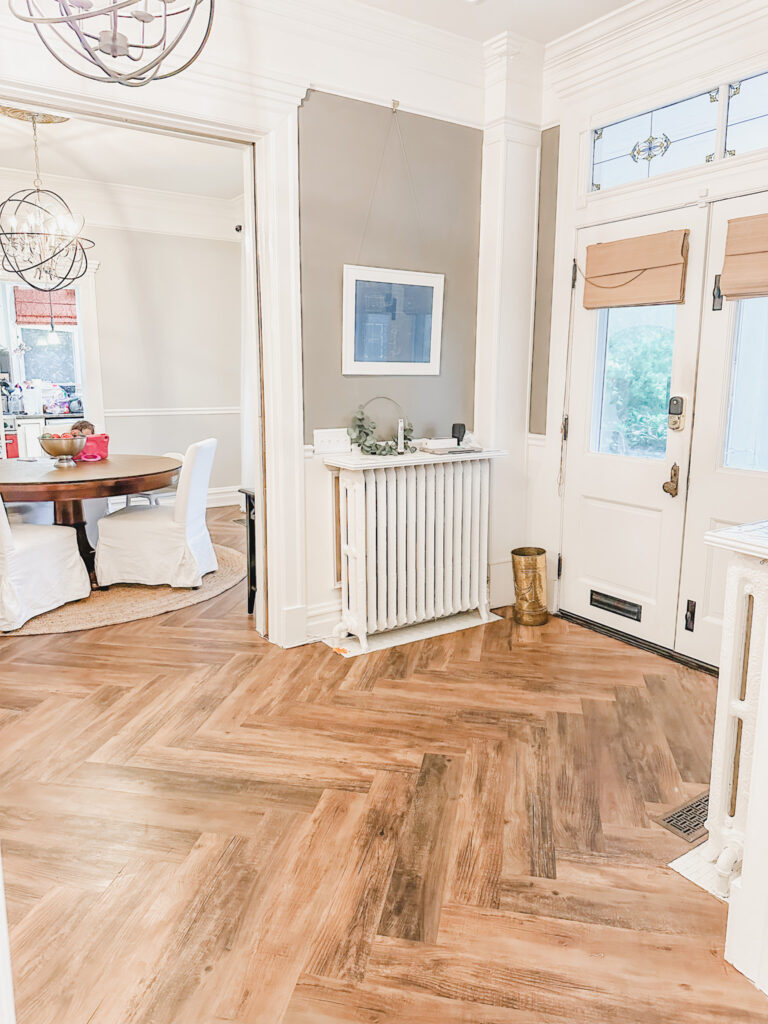 DIY peel and stick herringbone flooring foyer