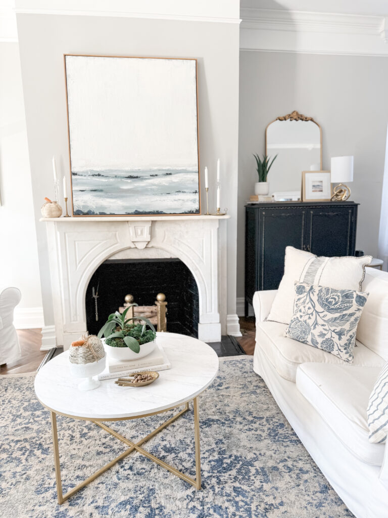 Cream pumpkin on white mantel