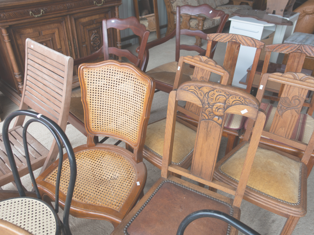 Old wooden chairs at a thrift store